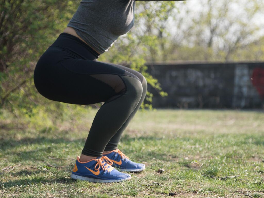 woman squatting in nature