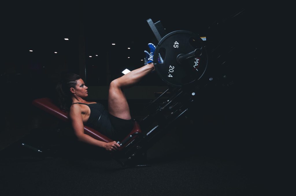 Does Keto Decrease Your Fitness Performance? Woman Pushing Barbel Using Her Feet